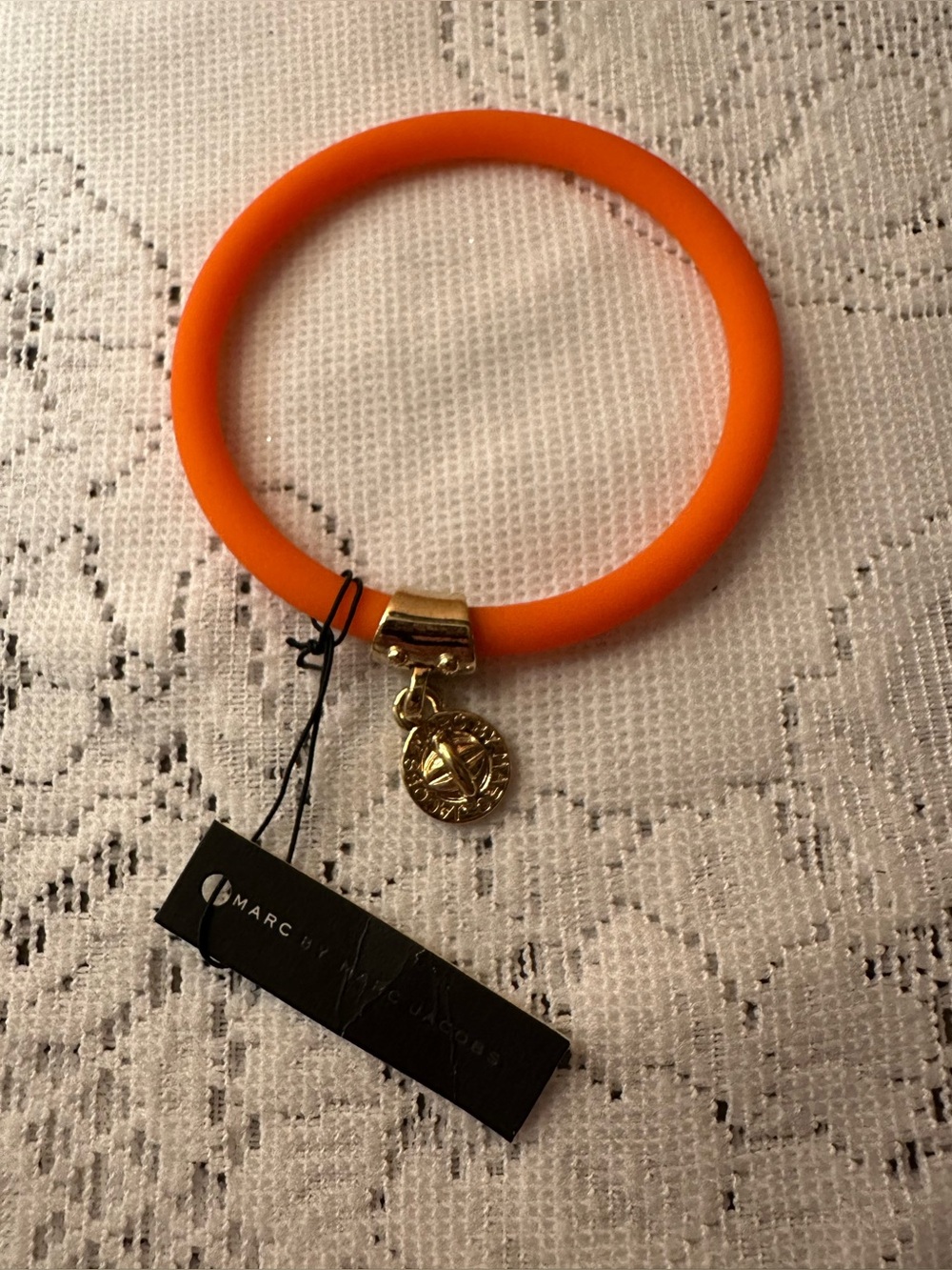 Marc by Marc Jacobs Fluoro Orange Silicone Bangle with signature Gold Charm